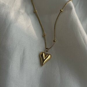 Sculpted heart pendant with gold chain