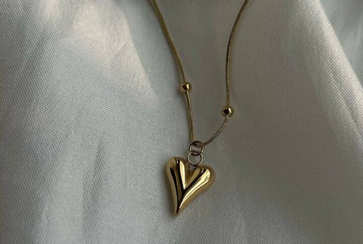 Sculpted heart pendant with gold chain